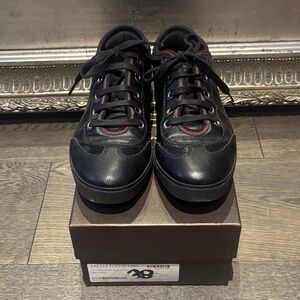 Gucci women’s GG Imprim Black Leather Sneaker. Light scuff marks right toe size